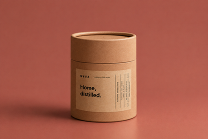 NAVA Home Distilled candle on a terracotta surface, blended sandalwood scent