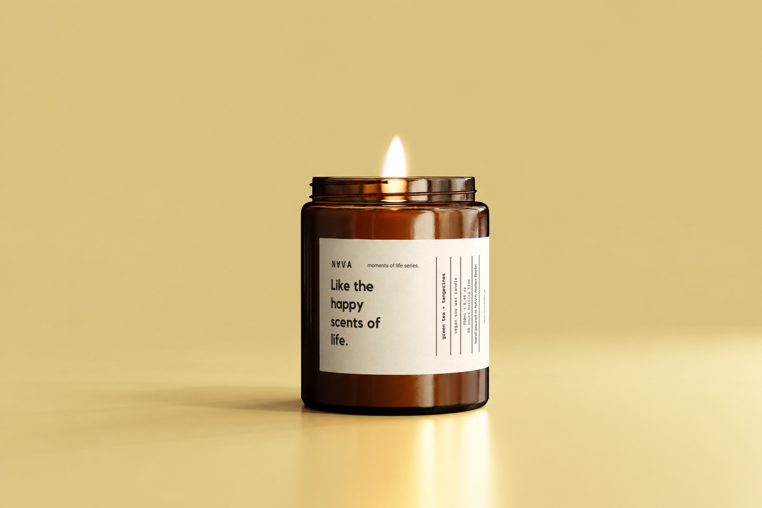 Like the Happy Scents of Life candle against a warm yellow background